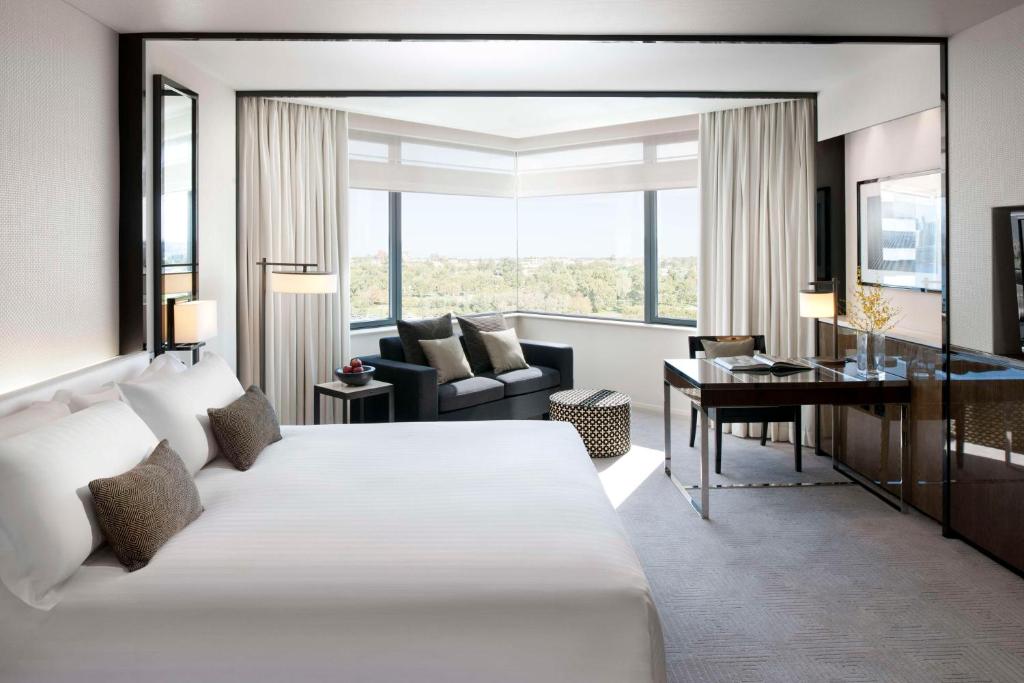 Modern king hotel room with luxury bedding